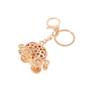 Cute alloy pumpkin car keychain with red enamel drip design, perfect bag charm and keyring.
