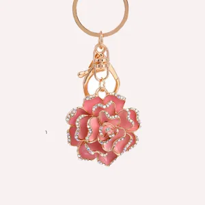 Detailed close-up of the elegant pink rose flower keychain, featuring sparkling rhinestones.