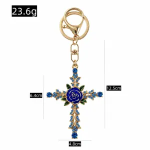 Detailed view of retro rhinestone blue rose cross keychain with size dimensions and weight.