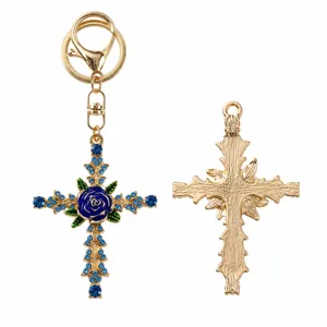 Retro rhinestone blue rose cross keychain detail, featuring gold metal and sparkling crystals.
