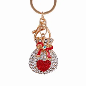 Crystal rhinestone lucky bag keychain, metal money pouch bag charm with red bow and heart.