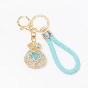 Luxury rhinestone lucky bag keychain detail showing metal hardware and braided leather strap.
