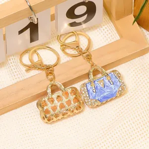 Luxus Metall Handtasche Schlüsselanhänger mit Strass und Emaille Design, Detail Accessoire.