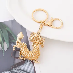 Detailed close-up view of the golden Chinese zodiac dragon keychain metal accessory.