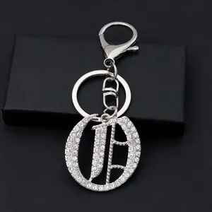 Silver metal letter keychain with sparkling rhinestones, stylish bag pendant gift.
