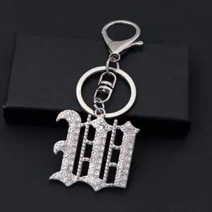 Silver rhinestone gothic letter keychain detail close-up view sparkling crystal charm accessory