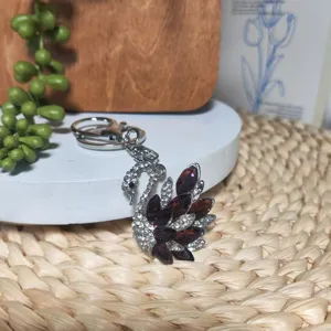 Crystal swan keychain and bag charm featuring sparkling rhinestones and silver alloy.