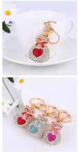 Detailed view of luxury rhinestone lucky bag keychain, sparkling crystal bag charm and key ring.