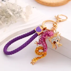 Chinese style zodiac dragon keychain with purple leather braided rope and rhinestones detail