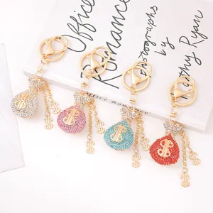 Rhinestone dollar money bag keychain metal crystal bag charm pendant keyring detail view.