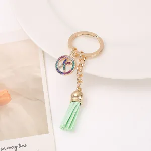 Rhinestone letter K keychain with light green leather tassel, cute bag charm accessory.