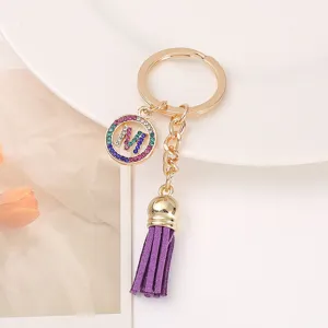 Metal rhinestone letter M keychain with purple tassel, stylish bag charm and keyring accessory.