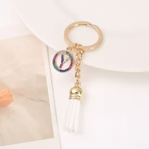 Gold letter Y keychain with colorful rhinestones and white tassel bag pendant fashion accessory.
