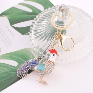 Rhinestone rooster keychain detail showcasing the sparkling crystals and colorful enamel finish.
