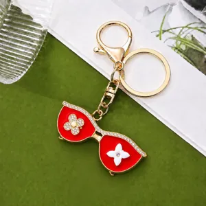 Luxury rhinestone sunglasses keychain with clover charm stylish bag pendant for keys charm accessory