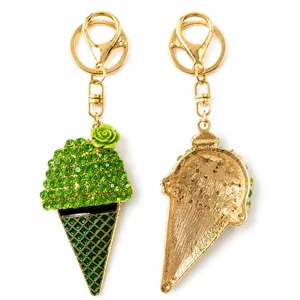 Detailed view of green rhinestone ice cream keychain with rose charm and metal back structure.