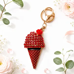 Rhinestone ice cream cone keyring detail shot with elegant gold hardware and red crystals.