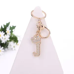 Golden rhinestone letter J keychain with crown pendant, elegant bag accessory and charm.