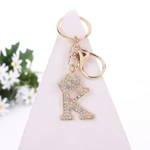 Rhinestone alloy letter K keychain with crown charm, stylish bag pendant accessory.