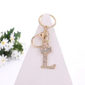 Rhinestone crown letter L keychain detail view, sparkling crystal alloy bag pendant and accessory.