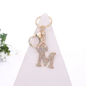 Gold rhinestone letter M keychain with crown pendant for bag accessory and stylish keyring decor