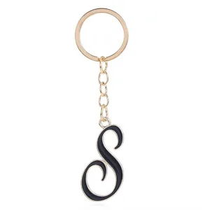Gold metal letter S keychain for women, elegant black enamel alphabet bag charm and keyring.