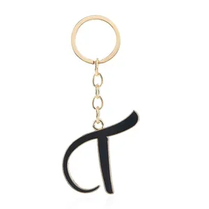 Golden metal keychain featuring a chic black enamel letter pendant for stylish bag charms.
