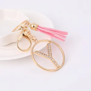 Exquisite gold metal rhinestone letter Y keychain with charming pink leather tassel for bags.