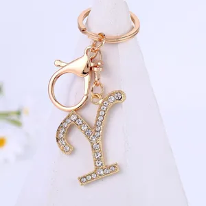 Gold alloy rhinestone letter Y keychain pendant, sparkling crystal alphabet keyring accessory.