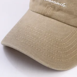 Khaki baseball cap for men and women, casual cotton hat with white embroidered letters.
