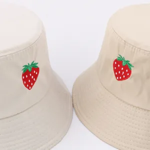Cute strawberry embroidered beige bucket hat for women, perfect for summer sun protection.