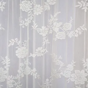 White lace curtain fabric close up floral sheer texture material soft interior panel