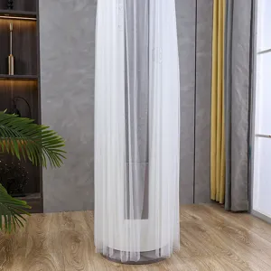 Cylindrical air conditioner dust cover detail, white sheer tulle fabric, elegant home decor.