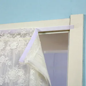 Lace mosquito net door curtain detail shot, white double layer minimalist style hanging.