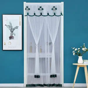 White sheer door curtain with green embroidered floral top for summer home decoration.