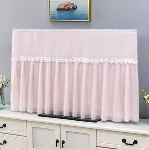 Detail view of a soft pink plush TV dust cover featuring elegant white floral lace trimming.
