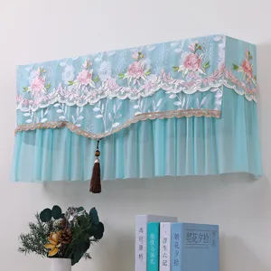 Vista dettagliata della elegante copertina antipolvere per condizionatore in pizzo.