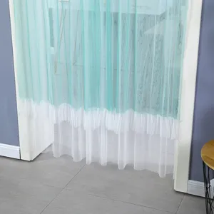 Detail shot of a teal and white mesh door curtain hanging in a doorway, sheer fabric design.