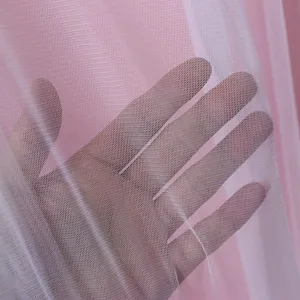 Close-up detail view of soft pink sheer curtain mesh fabric, breathable semi-transparent texture.