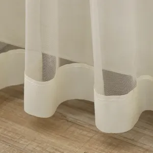 Sheer curtain bottom hem detail, double layer mesh fabric, light beige door curtain fabric close up.