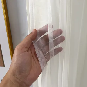 White sheer curtain fabric detail, lightweight mesh sheer material, elegant home decor.