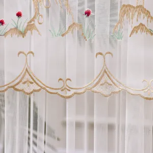White sheer curtain featuring elegant gold embroidery and delicate red floral accents.