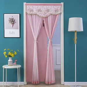 Detailed scene showing pink door curtain with floral lace valance and tie backs for bedroom use.