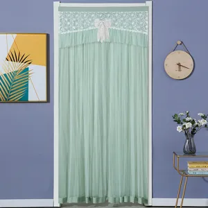 Green lace door curtain detail, elegant sheer mesh partition for home and bedroom use.