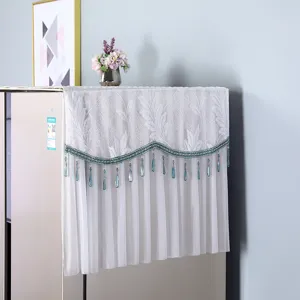 Detailed view of white lace refrigerator dust cover with blue beaded tassels for double door.