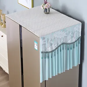 Refrigerator dust cover detail, elegant white quilted top and blue lace bead fringe.
