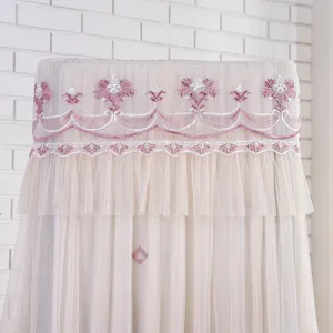 Lace upright air conditioner dust cover with delicate pink embroidery and mesh ruffles.