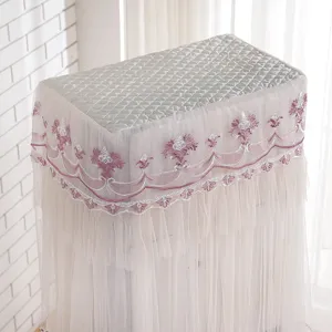 Detailed view of lace standing air conditioner dust cover with quilted top and pink embroidery.