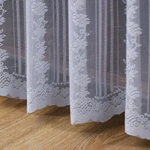 Detail view of white lace dust-proof curtain featuring elegant rose floral patterns.