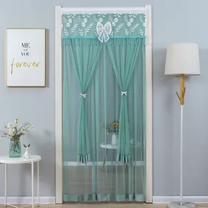Green lace door curtain detail, elegant floral embroidery and bow knot for room partition.